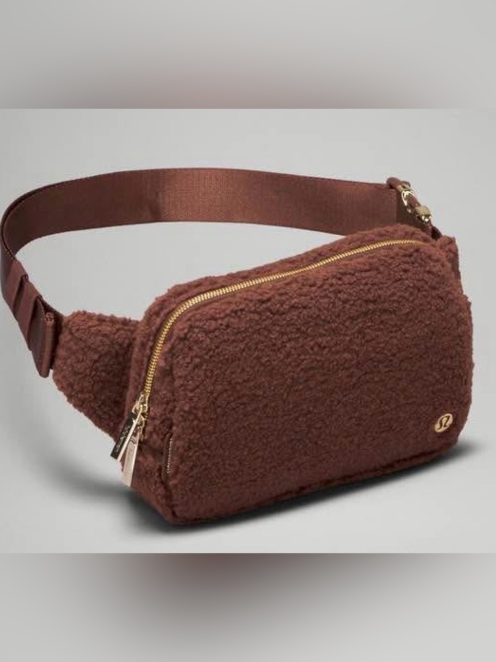lululemon brown sherpa belt bag with gold zipper